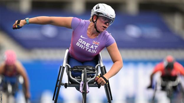 Britain's Hannah Cockroft crosses the finish line in race