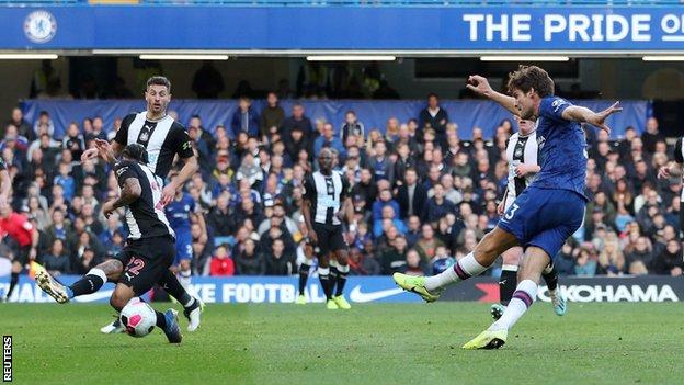 Marcos Alonso (right) scores