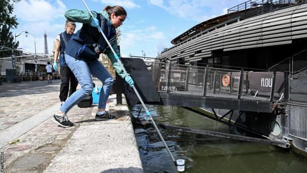 The water in the river Seine is tested before the 2024 Paris Olympics