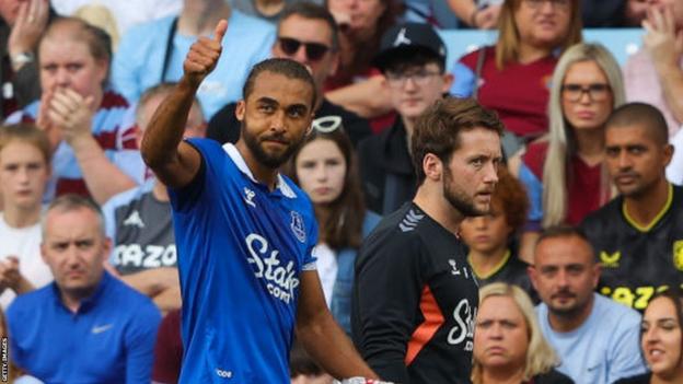 Dominic Calvert-Lewin gives a thumbs-up towards Everton fans after appearing to be booed at Villa Park