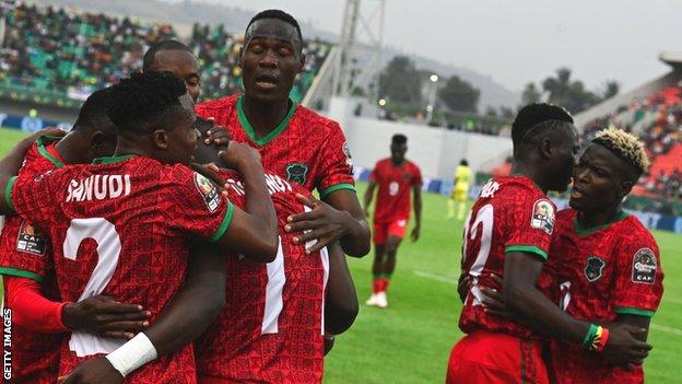 Malawi celebrate a goal against Zimbabwe