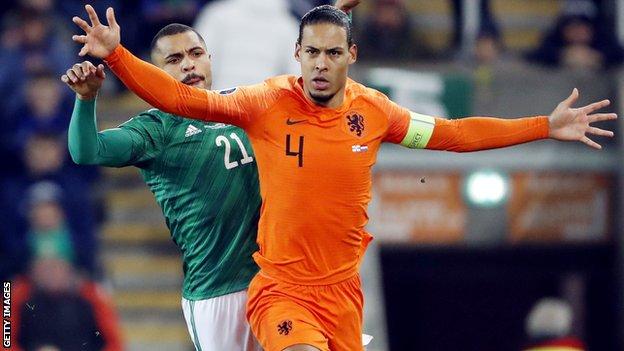 Josh Magennis and Virgil van Dijk