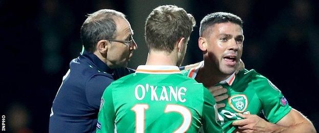 Martin O'Neill attempts to calm Jonathan Walters after some vigorous Moldovan challenges