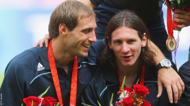 Pablo Zabaleta and Lionel Messi receive their gold medal at the 2008 Olympics