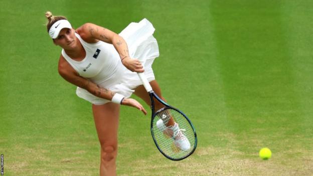 Marketa Vondrousova hits a serve in the Wimbledon semi-final