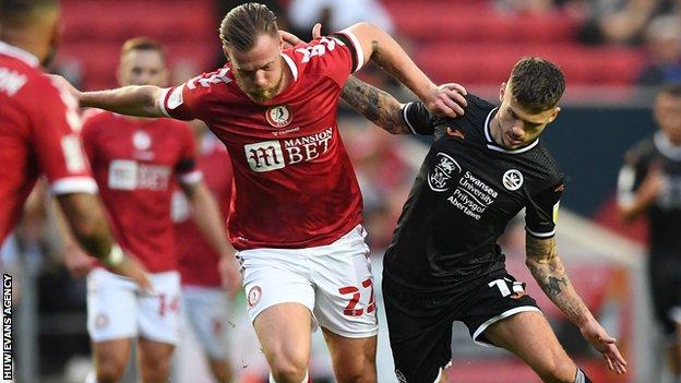 Jamie Paterson of Swansea City is tackled by Tomas Kalas of Bristol City