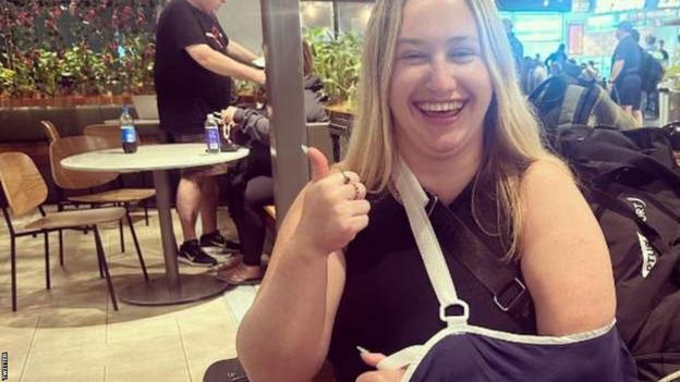 Australian reporter Isobel Cootes injured her shoulder celebrating Australia's quarter-final win