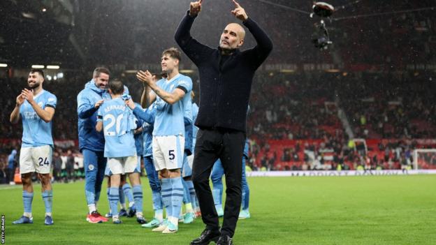 Manchester City boss Pep Guardiola celebrates with his players