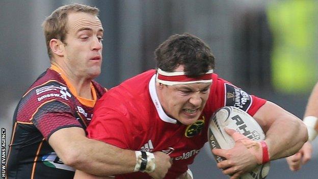 Robin Copeland of Munster is tackled by Sarel Pretorius