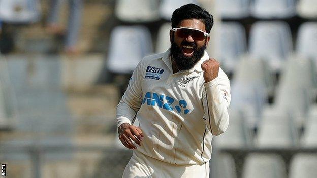 New Zealand spinner Ajaz Patel celebrates taking an India wicket