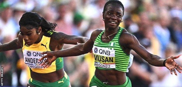 Tobi Amusan (right) celebrates her World Athletics Championships gold medal in the women's 100m hurdles