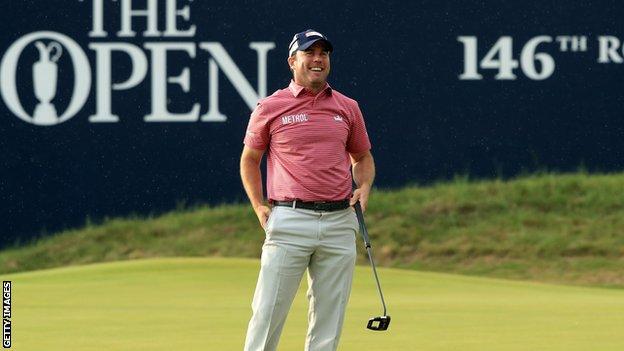 Richie Ramsay is in a good mood after sinking a birdie putt on the 18th green