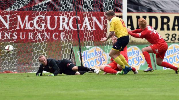 Dungannon Swifts midfielder Matthew Hazley hits the Portadown net to make it 1-1 at Shamrock Park