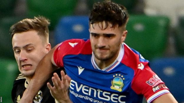 Euan East (right) in action for Linfield