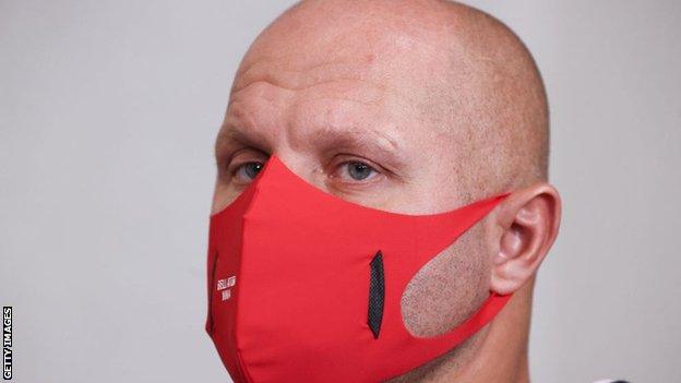 Mixed martial artist Fedor Emelianenko wears a face mask during an official weigh-in ceremony