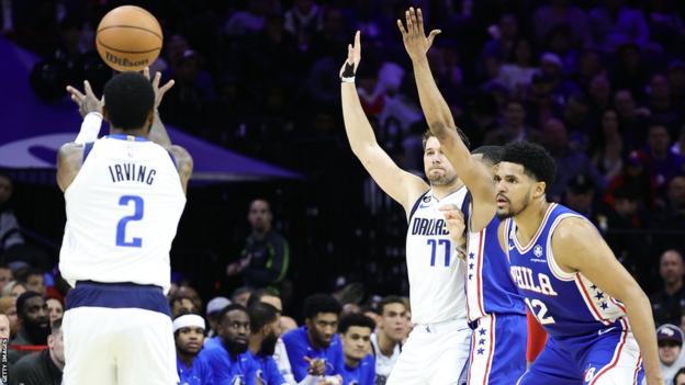 Players compete for ball during Dallas Mavericks v Philadelphia 76ers
