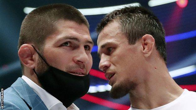 Usman Nurmagomedov speaks to his cousin Khabib after a fight