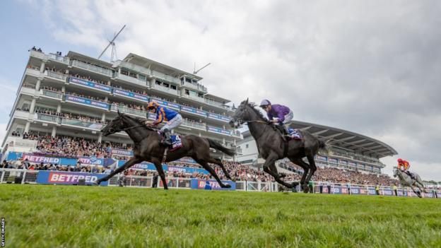 Horses Auguste Rodin and King Of Steel ride at the Epsom Derby