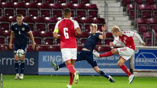 Denmark's Gustav Isaksen scores the opening goal during the UEFA Under-21 Championship Qualifier match between Scotland and Denmark