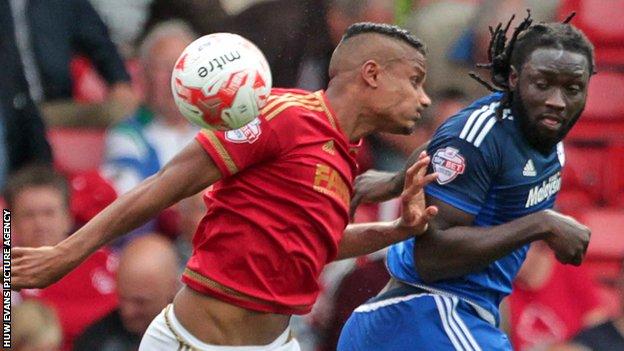Cardiff City striker Kenwyne Jones rises to put his side ahead