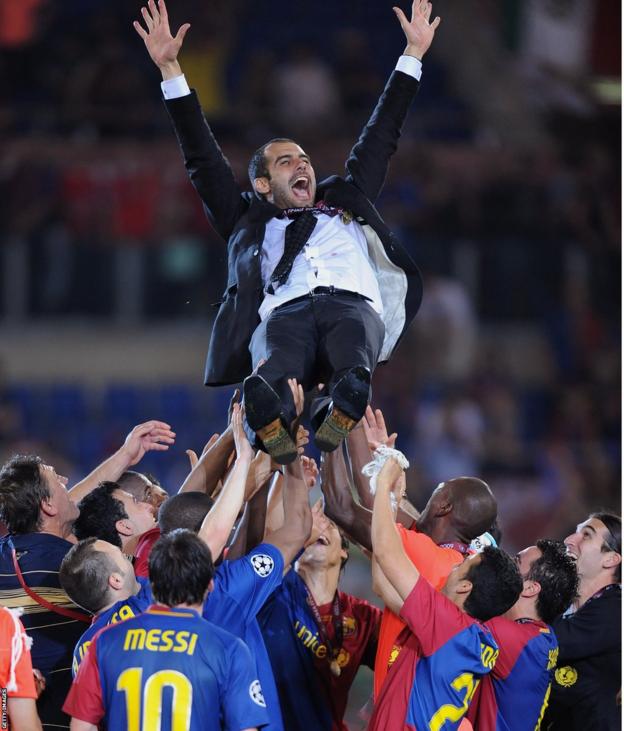 Pep Guardiola's is thrown aloft in celebration by his Barcelona players while Lionel Messi looks on