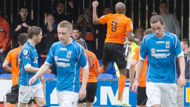 Miguel Chines leaps for joy as he celebrates scoring the first goal of his double for newly promoted Carrick Rangers against Dungannon Swifts