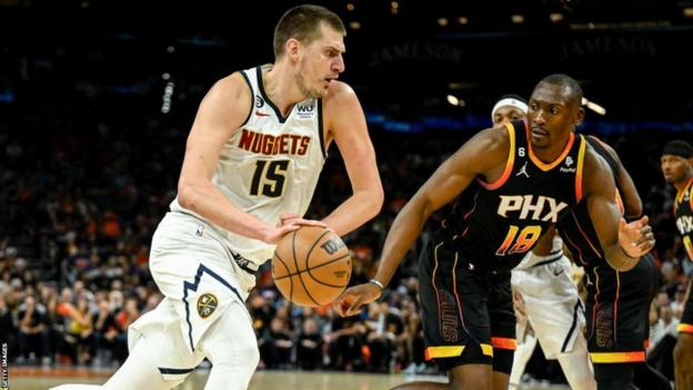 Nikola Jokic of the Denver Nuggets runs with the ball against the Phoenix Suns