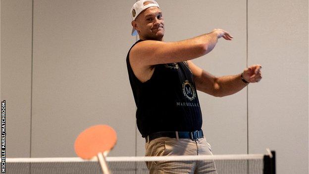 Tyson Fury throws a table tennis paddle