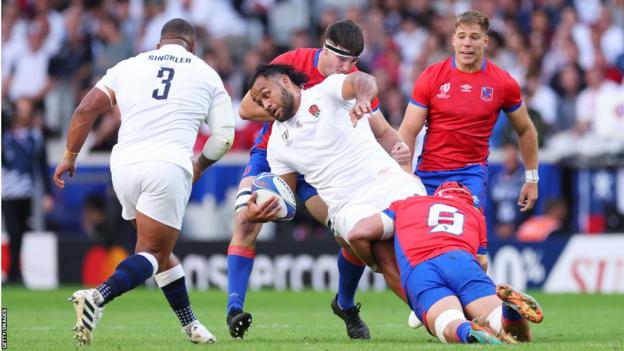 England number eight Billy Vunipola is tackled during the win over Chile