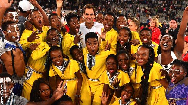 Roger Federer hugs kids after the Match in Africa against Rafael Nadal at Cape Town Stadium on 7 February 2020