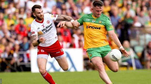 Patrick McBrearty is about to get a shot in at MacCumhaill Park despite Ronan McNamee's efforts