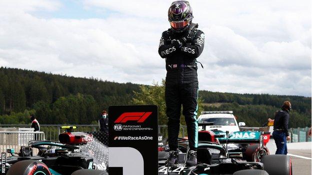 Lewis Hamilton on top of his car paying tribute to Chadwick Boseman