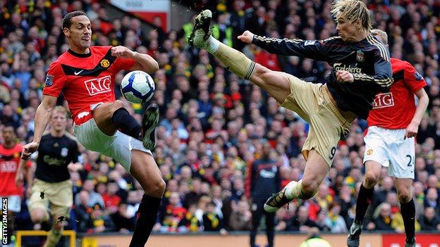 Rio Ferdinand clears from Fernando Torres