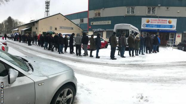 Rochdale's chief executive Russ Green handed out hot drinks to fans who queued in the snow for tickets to see Spurs. The tie is a sell-out at the 10,249-capacity ground