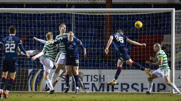 Jordan White (second right) heads the only goal of the game for Ross County