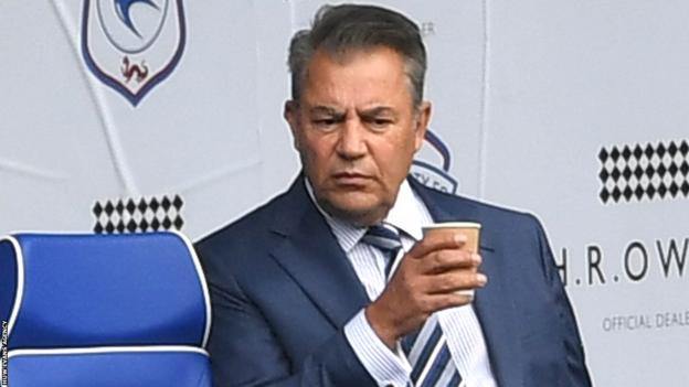 Cardiff City Chairman Mehmet Dalman holds a cup