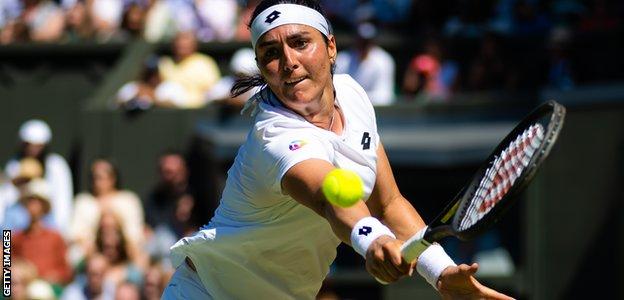 Ons Jabeur plays a backhand at Wimbledon