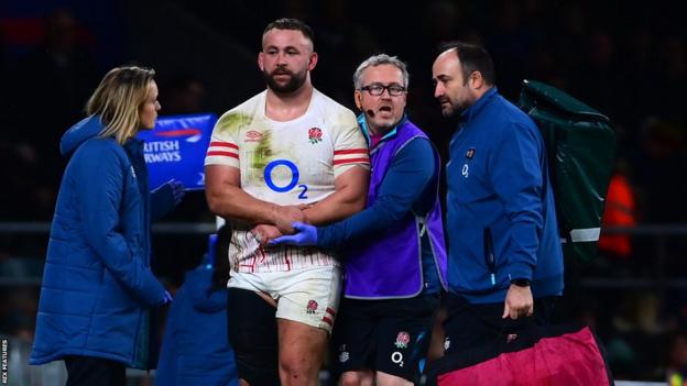 Will Stuart is tended to by medics as he goes off injured for England against South Africa