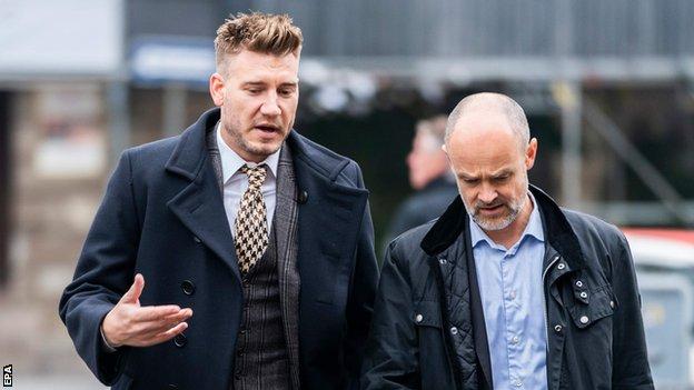 Nicklas Bendtner (left) and his lawyer Anders Nemeth arrive at court in Copenhagen