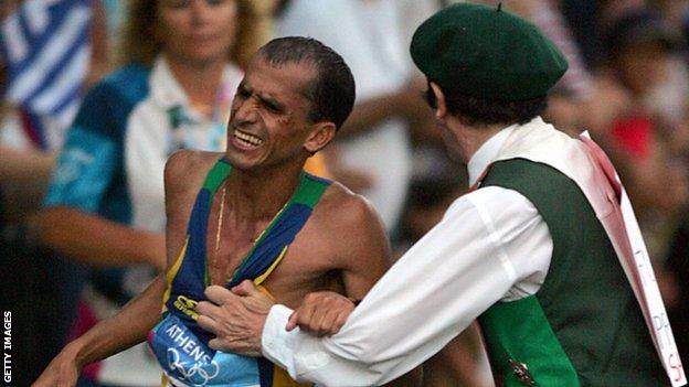The moment Irish priest Cornelius Horan lunged at 2004 Olympic marathon leader Vanderlei de Lima