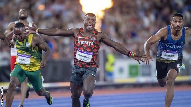 Ferdinand Omanyala celebrates after winning the 100m at the Commonwealth Games