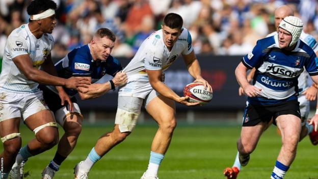 Exeter's Joe Hawkins carries the ball against Bath