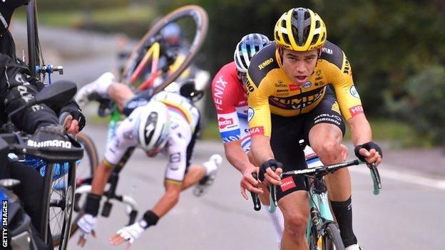 Julian Alaphilippe (back left) crashes behind Wout van Aert and Mathieu van der Poel