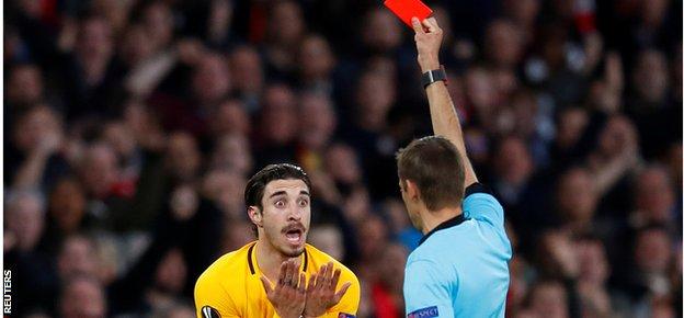 Atletico Madrid's Sime Vrsaljko is sent off in the 10th minute against Arsenal at Emirates Stadium