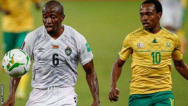 Zimbabwe's Gerald Takwara in action against South Africa's Percy Tau