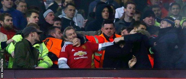 Stewards had to step in as trouble flared between fans at Old Trafford