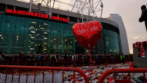 Fans gathered outside Old Trafford hours before kick-off to pay their respects to Sir Bobby Charlton