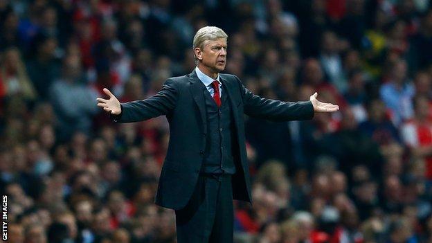 Arsene Wenger gesticulating on the touchline