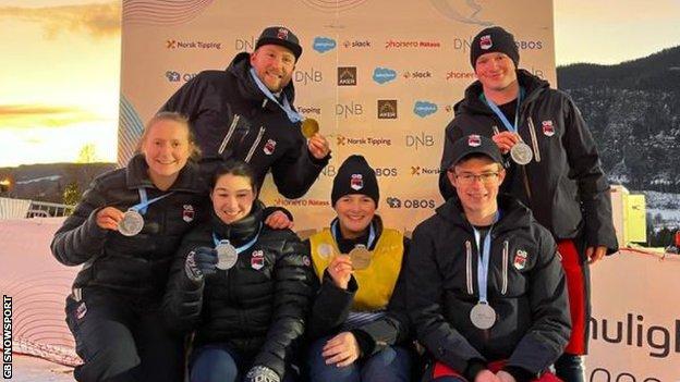 Great Britain para-athletes and their guides pose with medals