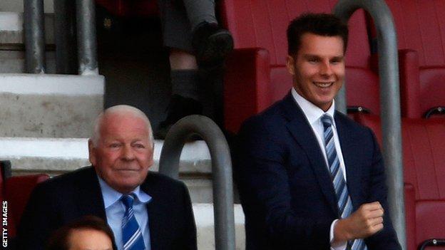 David Sharpe (right) took over as Wigan Athletic chairman from his grandfather Dave Whelan (left) in 2015